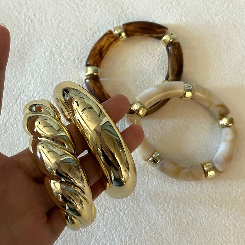 Bracciali vintage in resina e metallo dorato